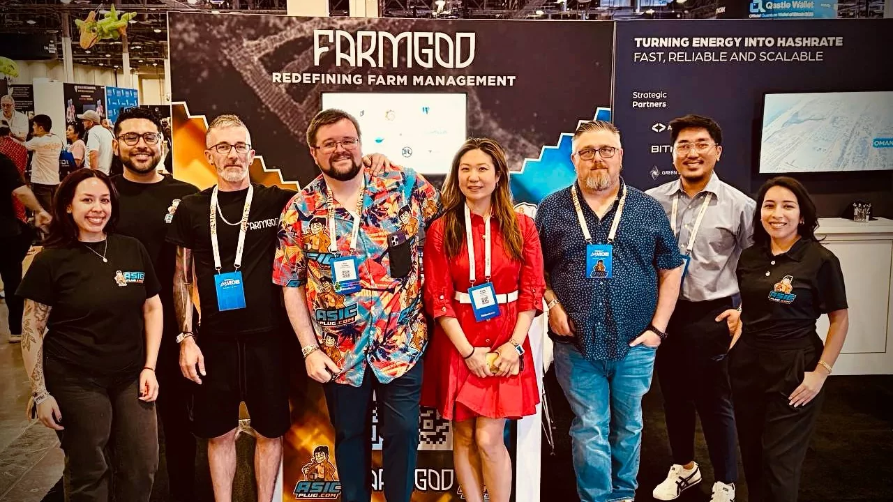 Part of the FARMGOD team at the booth at Bitcoin 2026 in Las Vegas